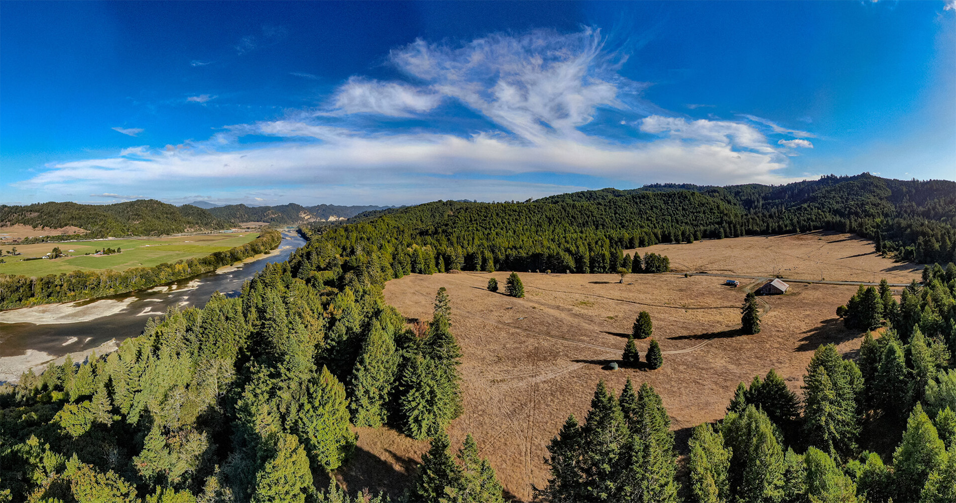 Aerial image of the property with pastoral lands, redwood forests, and the Eel River